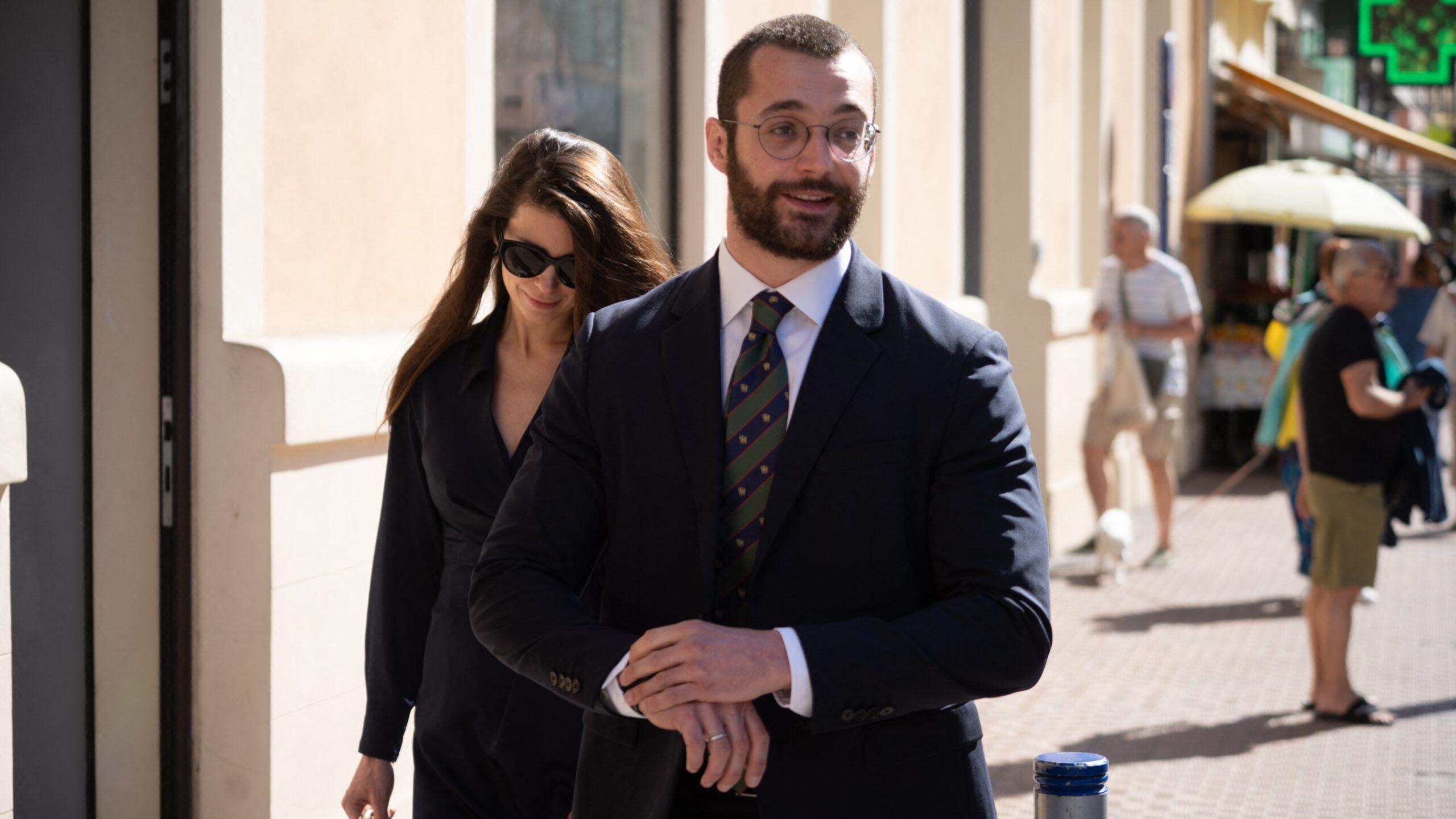 Louis Sarkozy walks through the streets of Menton with his wife Natali Husic before the book signing of his book on Napoleon Bonaparte in Menton in the South of France on May 15, 2025.