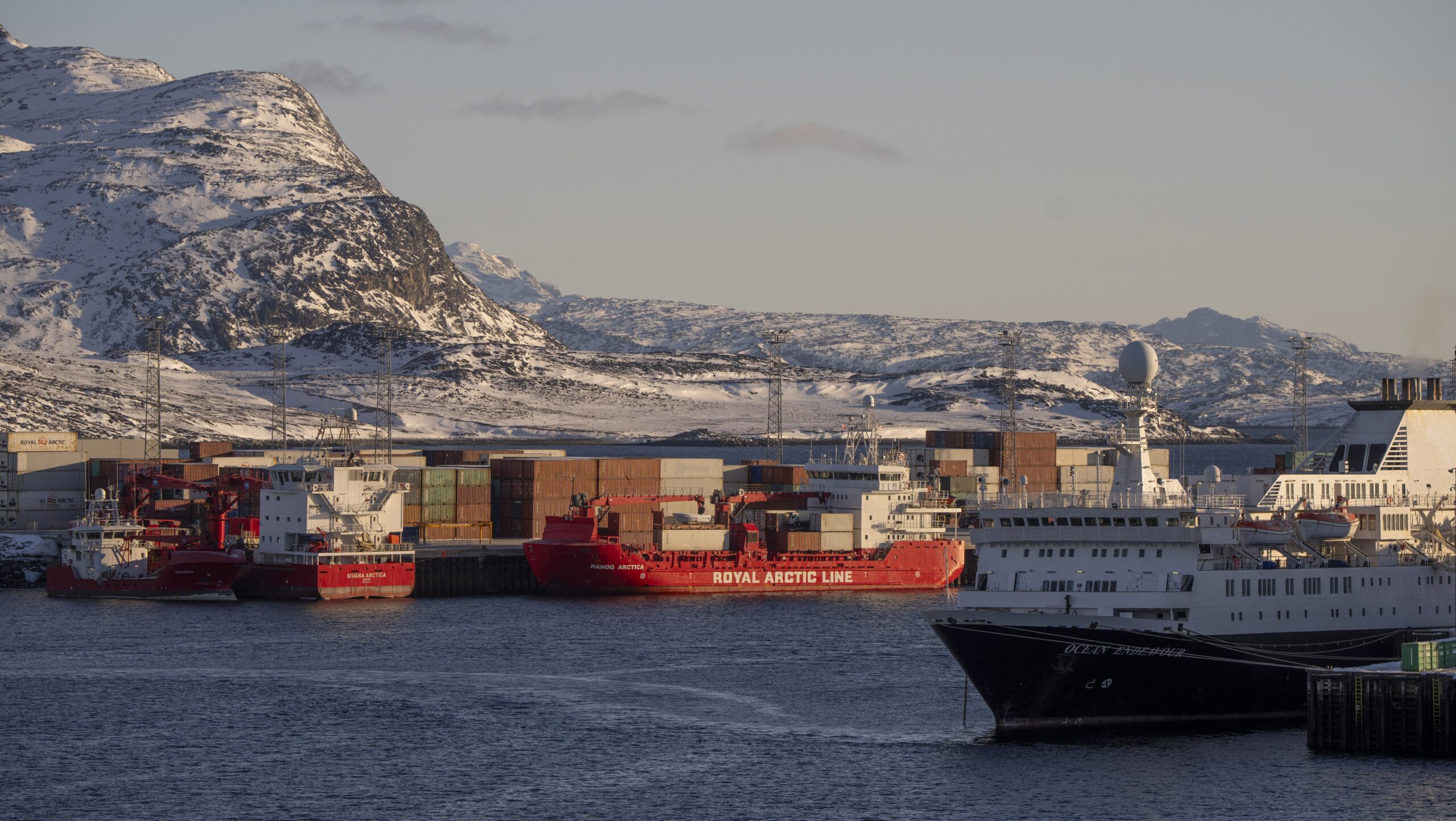 Royal Arctic Line container terminal behind Ocean Endeavour in Nuuk, Greenland